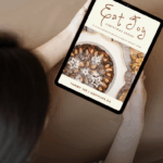 woman looking at Eat Joy Christmas recipe ebook