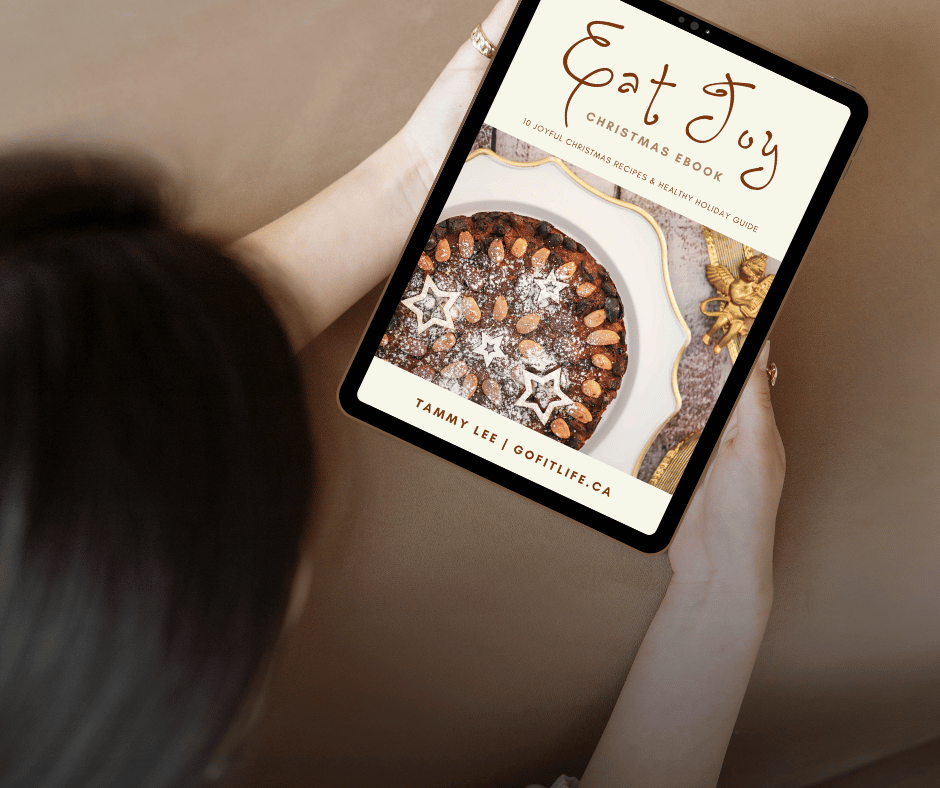 woman looking at Eat Joy Christmas recipe ebook