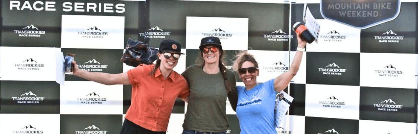 Three female mountain biking endurance athletes on the podium of a Transrockies mountain bike race